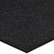 A black Lavex Needle Rib indoor entrance mat with a black stripe.