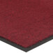 A red carpet mat with a black border.