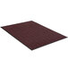 A close-up of a burgundy Lavex Chevron Rib entrance mat with black trim.