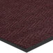 A burgundy Lavex carpet mat with a black border.