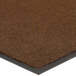 A roll of brown Lavex Olefin entrance mat with a black border.