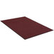 A red rectangular entrance mat with black trim.