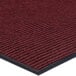 A red Lavex carpet entrance mat with a black border.
