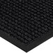 A close-up of a black Lavex waffle entrance mat with a black border.