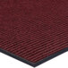 A red Lavex Needle Rib carpet mat with black borders.