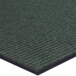 A green Lavex carpet entrance mat with black trim.