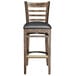 A Lancaster Table & Seating wood ladder back bar stool with a black vinyl seat detached.
