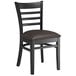A Lancaster Table & Seating black wood ladder back chair with a dark brown vinyl seat cushion.