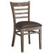 A Lancaster Table & Seating wood ladder back chair with dark brown vinyl seat on a white background.