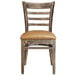 A Lancaster Table & Seating wood ladder back chair with light brown vinyl seat
