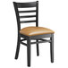 A black Lancaster Table & Seating wood ladder back chair with light brown vinyl seat.