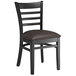 A Lancaster Table & Seating black wood ladder back chair with dark brown vinyl seat.