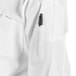 A close up of a white Uncommon Chef Classic Knot long sleeve chef coat.
