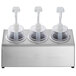 A Steril-Sil stainless steel condiment dispenser kit with white plastic pump lids on a counter.