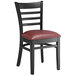 A Lancaster Table & Seating black wood ladder back chair with a burgundy vinyl seat.