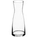An Acopa clear glass carafe with a white background.