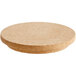 A round cork lid on a table.