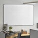 A Dynamic by 360 Office Furniture whiteboard mounted on a white wall.