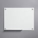 A Dynamic by 360 Office Furniture frameless frosted glass white board with silver metal clips.