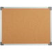 A Dynamic by 360 Office Furniture 24" x 18" cork board with an aluminum frame.