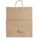 A brown Kraft paper bag with a handle and black text.