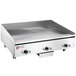 A large stainless steel Wolf countertop electric griddle with chrome plate.