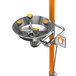 A stainless steel Guardian Equipment safety station with orange hand and foot controls.
