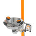 A stainless steel Guardian Equipment safety station with orange hand and foot controls.
