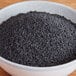 A bowl of Regal black caraway seeds.