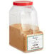A plastic container of brown powder labeled "Regal Roasted Garlic Granules" on a white background.