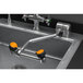 A Guardian Equipment AutoFlow eyewash station with two orange handles and a faucet.