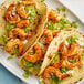 A plate of shrimp tacos with Regal Blackened Seasoning.