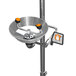 A polished chrome Guardian Equipment safety station with an eyewash and orange handle on a metal sink.