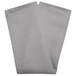 A folded grey Milan Birdseye cloth napkin with a white and black diamond pattern.