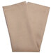 A folded Snap Drape Sandalwood Milan birdseye cloth napkin with tan and white checks on a white background.