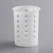 A white polypropylene container with holes.