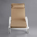 A white Lancaster Table & Seating chaise lounge with tan cushions.