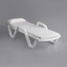 A white Lancaster Table & Seating chaise lounge with a white cushion on it.