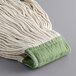 A close up of a natural cotton Choice wet mop head with a green loop.