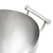 A Vollrath stainless steel serving bowl with handles.