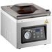 A white VacPak-It chamber vacuum packing machine with a glass lid and digital display.