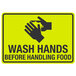 A yellow sign with black text and a hand washing symbol that says "Wash Hands Before Handling Food"