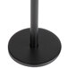 A black metal pole with a round base.
