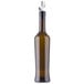 A Tablecraft dark green glass oil and vinegar bottle with a weighted stainless steel pourer.