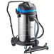 A Lavex wet/dry vacuum with a blue and black handle and wheels.