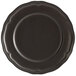 An Acopa Condesa black porcelain plate with a scalloped rim.