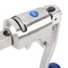 An Edlund stainless steel commercial can opener with a blue handle and metal clamp.