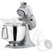 A KitchenAid Artisan stand mixer in metallic chrome with a bowl and attachment.