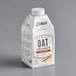 A carton of Elmhurst Chai Spice Oat Creamer with a white background.