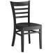 A Lancaster Table & Seating black wood ladder back chair with black seat.